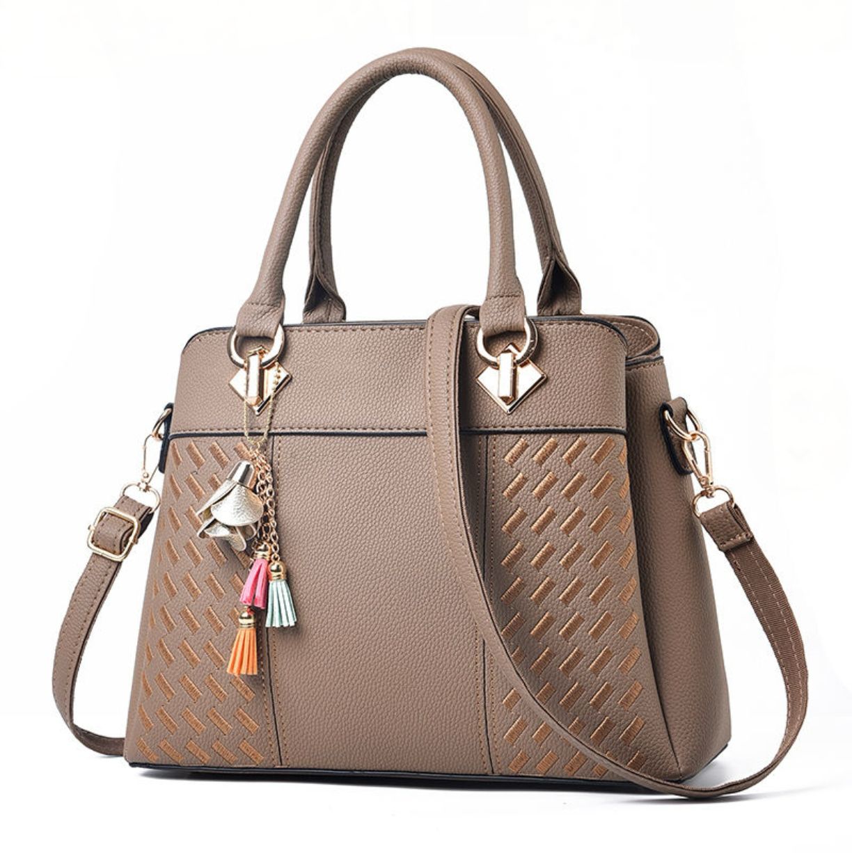 Brown handbag with decorative charms on a white background